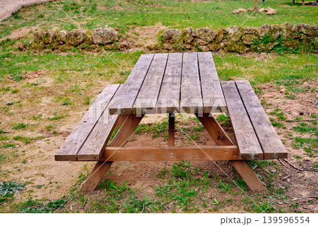 Outdoors picnic area wooden table Outdoors picnic area wooden table 139596554