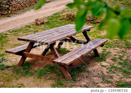 Outdoors picnic area wooden table Outdoors picnic area wooden table 139596556