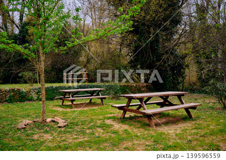 Outdoors picnic area wooden table Outdoors picnic area wooden table 139596559