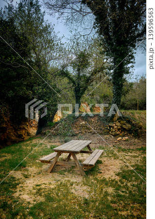 Outdoors picnic area wooden table Outdoors picnic area wooden table 139596563