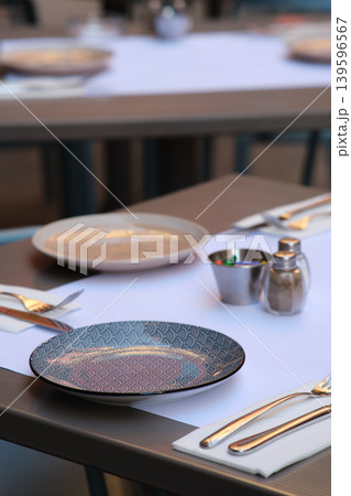 Beautiful table setting in the restaurant Beautiful table setting in the restaurant 139596567