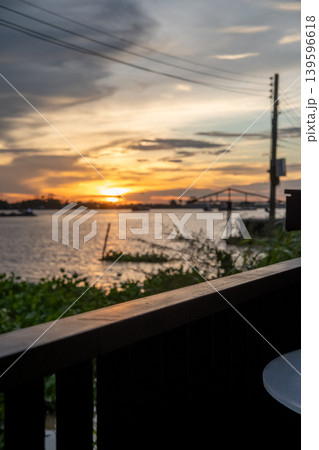 Sunset sky with the silhouette of riverside building Sunset sky with the silhouette of riverside building 139596618
