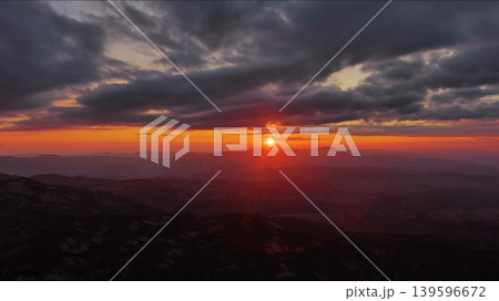 Sunset over mountain with dramatic clouds 139596672
