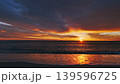 Sunset over sea with vibrant red and orange sky 139596725