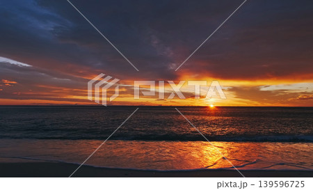 Sunset over sea with vibrant red and orange sky 139596725