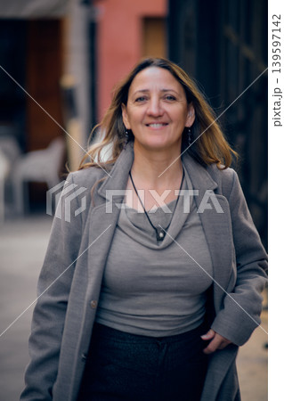 portrait of a young woman on a city street portrait of a young woman on a city street 139597142