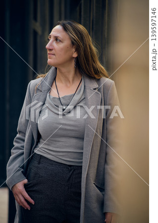 portrait of a young woman on a city street portrait of a young woman on a city street 139597146