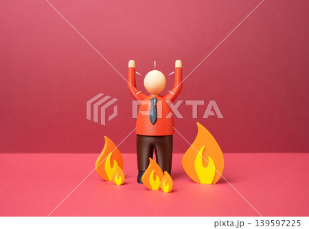 An office worker panics in the middle of a fire. Stress and burnout at work. Workplace anxiety, emotional exhaustion and pressure caused by corporate overload and deadlines. 139597225