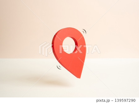 Red geolocation button on a map. Navigation and location tracking. Points of interest. Traffic monitoring and travel planning. 139597290