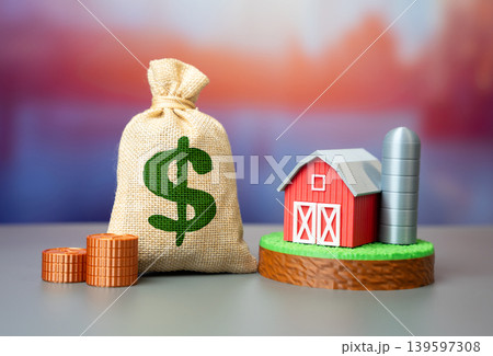 A farm on a plot of land with a dollar sign. Investing in agribusiness. Land valuation and profit potential in the agricultural sector. A farm on a plot of land with a dollar sign. Investing in agribusiness. Land valuation and profit potential in the agricultural sector. 139597308