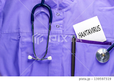 Hantavirus medical words symbol. Concept words Hantavirus on beautiful white card on medical uniform. Beautiful blue background. Beautiful pen. Stethoscope. Medical Hantavirus concept. Copy space. Hantavirus medical words symbol. Concept words Hantavirus on beautiful white card on medical uniform. Beautiful blue background. Beautiful pen. Stethoscope. Medical Hantavirus concept. Copy space. 139597319