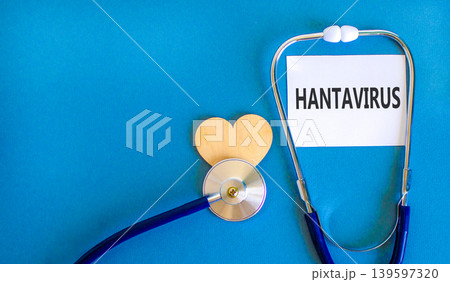 Hantavirus medical words symbol. Concept words Hantavirus on beautiful white card. Beautiful blue background. Beautiful wooden heart. Beautiful stethoscope. Medical Hantavirus concept. Copy space. Hantavirus medical words symbol. Concept words Hantavirus on beautiful white card. Beautiful blue background. Beautiful wooden heart. Beautiful stethoscope. Medical Hantavirus concept. Copy space. 139597320