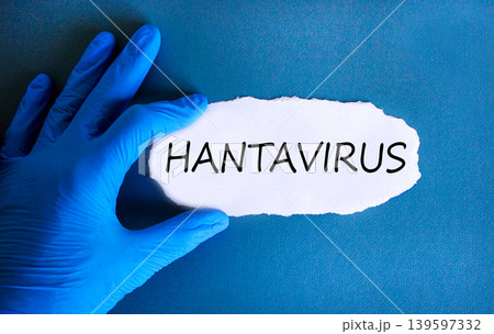 Hantavirus medical words symbol. Concept words Hantavirus on beautiful white paper. Beautiful blue background. Doctor hand. Blue glove. Medical Hantavirus concept. Copy space. 139597332
