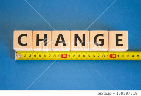 Change symbol. Concept word Change on beautiful wooden blocks. Beautiful blue background. Beautiful yellow tape measure ruler. Business change concept. Copy space. Change symbol. Concept word Change on beautiful wooden blocks. Beautiful blue background. Beautiful yellow tape measure ruler. Business change concept. Copy space. 139597519