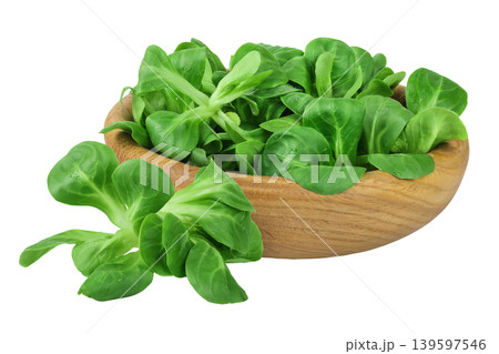 Valerian leaves salad. Corn salad in wooden bowl isolated on white backgrounds. Lettuce salad. Valerian leaves salad. Corn salad in wooden bowl isolated on white backgrounds. Lettuce salad. 139597546
