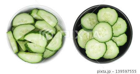 Sliced cucumber in ceramic bowl isolated on white background with full depth of field. Top view. Flat lay. 139597555