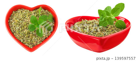 Oregano or marjoram leaves fresh and dry in ceramic bowl isolated on white background. Top view. Flat lay 139597557