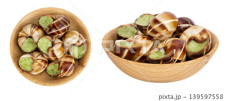 escargot snail filled with garlic and parsley butter in wooden bowl isolated on white background. Top view. Flat lay 139597558