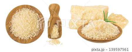 grated parmesan cheese in wooden bowl and scoop isolated on white background. Top view. Flat lay 139597561