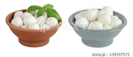 Mini mozzarella balls with basil leaf in a ceramic bowl isolated on white background with full depth of field. 139597572