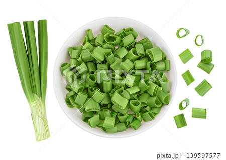 Green onion in ceramic bowl isolated on the white background. Top view. Flat lay. 139597577