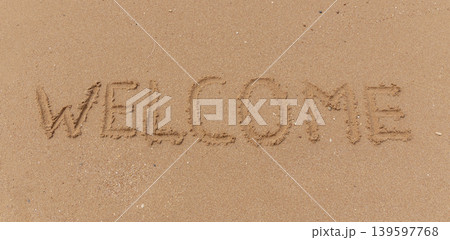 Business hello and welcome concept. Concept word Welcome written on beautiful ocean sea sand beach. Beautiful ocean sand beach background, copy space. Business hello and welcome concept. Business hello and welcome concept. Concept word Welcome written on beautiful ocean sea sand beach. Beautiful ocean sand beach background, copy space. Business hello and welcome concept. 139597768