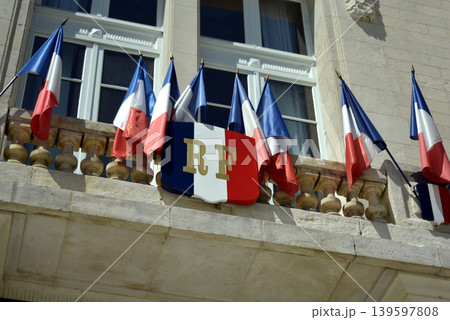 closeup of flags of France on the french city hall facade in the street closeup of flags of France on the french city hall facade in the street 139597808