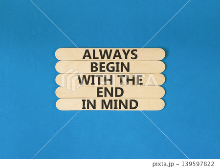 Begin with the end in mind symbol. Concept words Always begin with the end in mind on beautiful wooden sticks. Beautiful blue background. Business begin with the end in mind concept. Copy space. 139597822