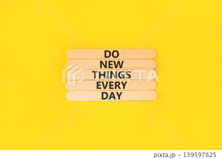 Do new things every day words symbol. Concept words Do new things every day on beautiful wooden sticks. Beautiful yellow paper background. Business do new things every day concept. Copy space. Do new things every day words symbol. Concept words Do new things every day on beautiful wooden sticks. Beautiful yellow paper background. Business do new things every day concept. Copy space. 139597825
