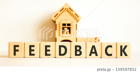 Feedback word symbol. Concept word Feedback on beautiful wooden blocks. Beautiful white background. Beautiful miniature wooden house. Business support help feedback word concept. Copy space. 139597852