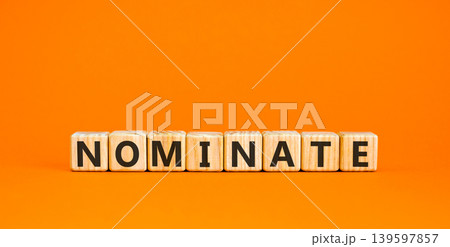 Nominate word symbol. Concept word Nominate on beautiful wooden blocks. Beautiful orange background. Business support help nominate word concept. Copy space. Nominate word symbol. Concept word Nominate on beautiful wooden blocks. Beautiful orange background. Business support help nominate word concept. Copy space. 139597857