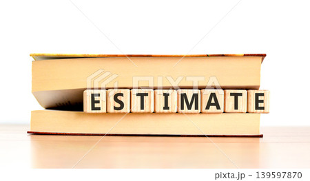 Estimate word symbol. Concept word Estimate on beautiful wooden blocks in beautiful book. Beautiful wooden table white background. Business support help estimate word concept. Copy space. Estimate word symbol. Concept word Estimate on beautiful wooden blocks in beautiful book. Beautiful wooden table white background. Business support help estimate word concept. Copy space. 139597870