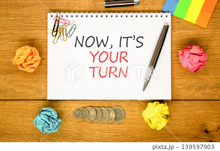 Now it's your turn symbol. Concept words Now it's your turn on beautiful white note. Beautiful wooden background. Colored paper. Business Now it's your turn motivational support concept. Copy space 139597903