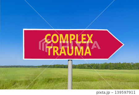 Complex trauma words symbol. Concept words Complex trauma on beautiful red road sign. Beautiful blue sky green field background. Psychological complex trauma support concept. Copy space. 139597911