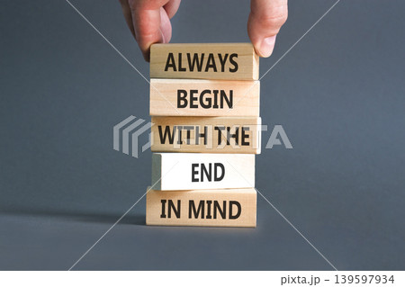 Begin with the end in mind symbol. Concept words Always begin with the end in mind on beautiful wooden blocks. Beautiful grey paper background. Business begin with the end in mind concept. Copy space. 139597934