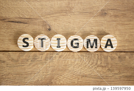 Stigma word symbol. Concept word Stigma on beautiful wooden circles. Beautiful wooden background. Business psychological stigma word concept. Copy space. Stigma word symbol. Concept word Stigma on beautiful wooden circles. Beautiful wooden background. Business psychological stigma word concept. Copy space. 139597950