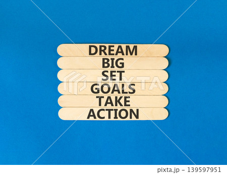 Dream big take action words symbol. Concept words Dream big Set goals Take action on beautiful wooden sticks. Beautiful blue background. Business Dream big Set goals Take action concept. Copy space. 139597951