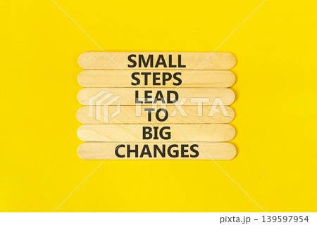 Small steps big changes words symbol. Concept words Small steps lead to big changes on beautiful wooden sticks. Beautiful yellow background. Business small steps big changes concept. Copy space. Small steps big changes words symbol. Concept words Small steps lead to big changes on beautiful wooden sticks. Beautiful yellow background. Business small steps big changes concept. Copy space. 139597954