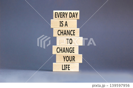 Change your life symbol. Concept words Every day is a chance to change your life on beautiful wooden blocks. Beautiful grey paper background. Business change your life concept. Copy space. Change your life symbol. Concept words Every day is a chance to change your life on beautiful wooden blocks. Beautiful grey paper background. Business change your life concept. Copy space. 139597956
