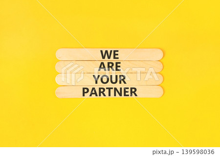 We are your partner words symbol. Concept words We are your partner on beautiful wooden sticks. Beautiful yellow background. Business motivational we are your partner concept. Copy space. We are your partner words symbol. Concept words We are your partner on beautiful wooden sticks. Beautiful yellow background. Business motivational we are your partner concept. Copy space. 139598036