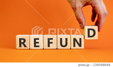 Refund word symbol. Concept word Refund on beautiful wooden blocks. Beautiful orange background. Businessman's hand. Business word refund concept. Copy space. Refund word symbol. Concept word Refund on beautiful wooden blocks. Beautiful orange background. Businessman's hand. Business word refund concept. Copy space. 139598049