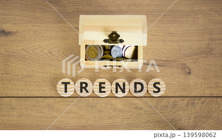 Trends trend word symbol. Concept word Trends on beautiful wooden circles. Beautiful wooden background. Beautiful wooden chest with coins. Business trends trend word concept. Copy space. Trends trend word symbol. Concept word Trends on beautiful wooden circles. Beautiful wooden background. Beautiful wooden chest with coins. Business trends trend word concept. Copy space. 139598062