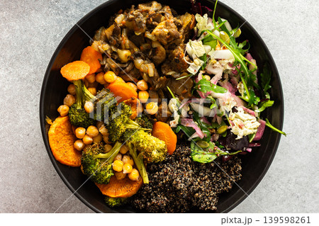 A filling, balanced breakfast with black quinoa, avocado, roast chicken, sweet potatoes, zucchini, broccoli, and a refreshing cabbage and radish salad with chia and sesame seeds A filling, balanced breakfast with black quinoa, avocado, roast chicken, sweet potatoes, zucchini, broccoli, and a refreshing cabbage and radish salad with chia and sesame seeds 139598261