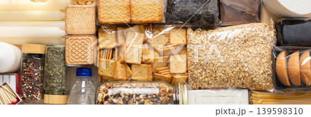 Essential home food stock for military operations and crises and for the period of quarantine and isolation, canned food, pasta, flour and nonperishable items,the concept of stay at home, banner 139598310