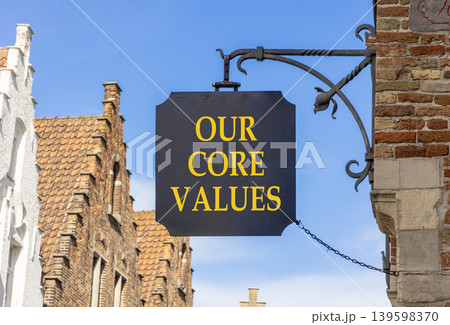Our core values words symbol. Concept words Our core values on beautiful black road sign. Beautiful blue sky Brugge street background. Business our core values motivational support concept. Copy space 139598370
