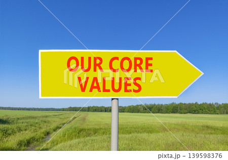 Our core values words symbol. Concept words Our core values on beautiful yellow road sign. Beautiful blue sky green field background. Business our core values motivational support concept. Copy space. 139598376