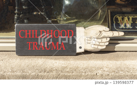 Childhood trauma words symbol. Concept words Childhood trauma on beautiful black wooden sign. Beautiful shopfront background. Psychological childhood trauma support concept. Copy space. Childhood trauma words symbol. Concept words Childhood trauma on beautiful black wooden sign. Beautiful shopfront background. Psychological childhood trauma support concept. Copy space. 139598377