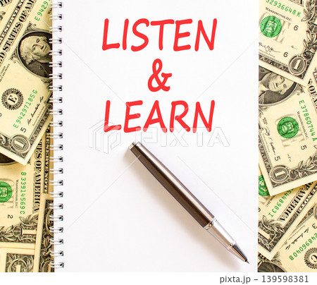 Listen and learn words symbol. Concept words Listen and learn on beautiful white note. Beautiful dollar bills background. Dollar bills. Business listen and learn support concept. Copy space. 139598381