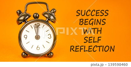 Self reflection symbol. Concept words Success begins with self reflection on beautiful orange paper. Beautiful orange paper background. Business success begins with self reflection concept. Copy space 139598460