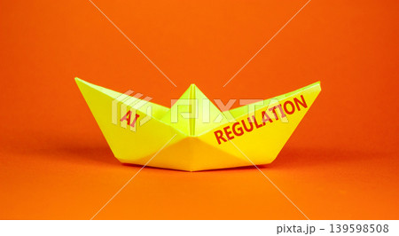 AI regulation symbol. Concept words AI artificial intelligence regulation on beautiful paper boat. Beautiful orange background. Business AI artificial intelligence regulation concept. Copy space. AI regulation symbol. Concept words AI artificial intelligence regulation on beautiful paper boat. Beautiful orange background. Business AI artificial intelligence regulation concept. Copy space. 139598508